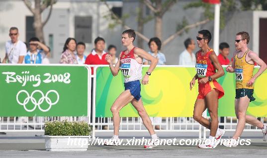 Russia's Denis Nizhegorodov (L) competes during men's 50km walk outside the National Stadium, also known as the Bird's Nest, during Beijing 2008 Olympic Games in Beijing, China, Aug. 22, 2008. [Liao Yujie/Xinhua]