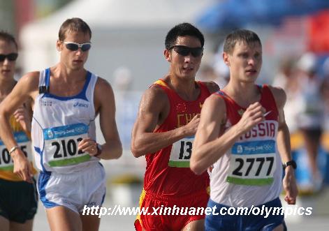 China's Li Jianbo (R2) competes with Russia's Denis Nizhegorodov (R1) during men's 50km walk at the National Stadium, also known as the Bird's Nest, during Beijing 2008 Olympic Games in Beijing, China, Aug. 22, 2008.[Liao Yujie/Xinhua]