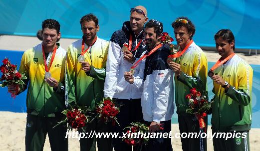 (L-R)Silver medalists Fabio Magalhaes/Marcio Araujo of Brazil, gold medalists Philip Dalhausser/Todd Rogers of the United States and bronze medalists Ricardo Santos/Emanuel Rego of Brazil pose on the podium during awarding ceremony of men's beach volleyball at the Beijing Olympic Games in Beijing, China, Aug. 22, 2008. [Gaesang Dawa/Xinhua]