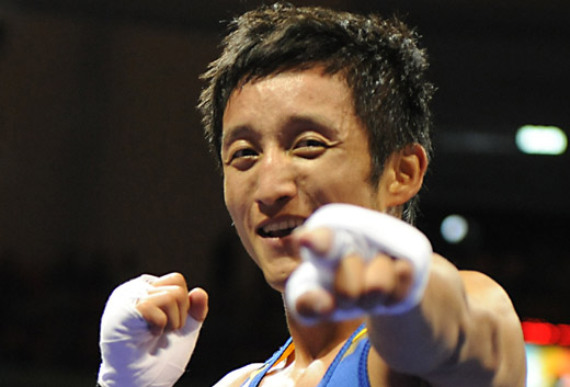 China's medal hope and world boxing champion of light flyweight (48kg) Zou Shiming advanced into the final at the Beijing Olympic Games by beating Paddy Barnes from Ireland 15-0 on August 22, 2008. [Xinhua]