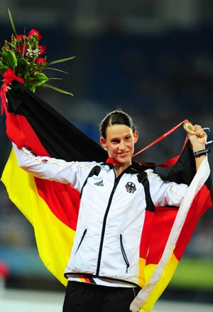 Gold medalist Lena Schoneborn of Germany poses on podium during victory ceremony of the women's modern pentathlon at the Beijing 2008 Olympic Games in Beijing, China, Aug. 22, 2008. (Xinhua/Luo Xiaoguang)