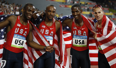 LaShawn Merritt, Angelo Taylor, David Neville and Jeremy Wariner (From L to R) of the United States celebrate after the men's 4x400m relay final at the National Stadium, also known as the Bird's Nest, during Beijing 2008 Olympic Games in Beijing, China, Aug. 23, 2008. The team of the United States won the title with 2:55.39 and set a new Olympic record. [Liao Yujie/Xinhua]