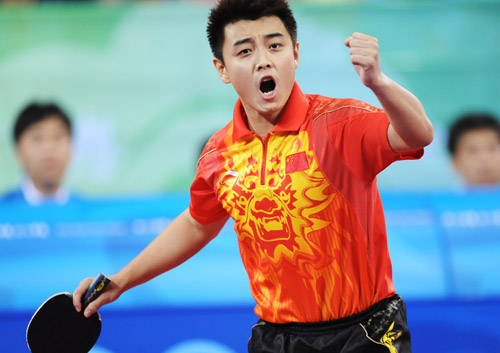 Wang Hao celebrates winning a point. (Photo credit: Xinhua)