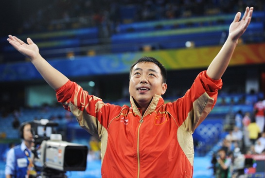 Liu Guoliang celebrates the victory gained by his pupils.