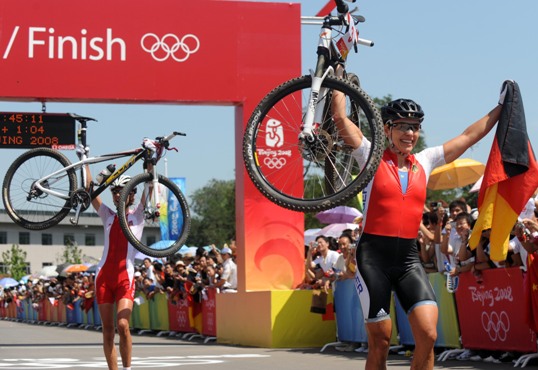 Sabine Spitz of Germany won the women's cross country mountain bike gold medal at the Beijing Olympic Games here on Saturday. Spitz clocked in 1:45.11 to win the title, Maja Wloszczowska of Poland got the silver by 0.41 seconds and Russian Irina Kalentyeva finished third by 1:17. [Xinhua]