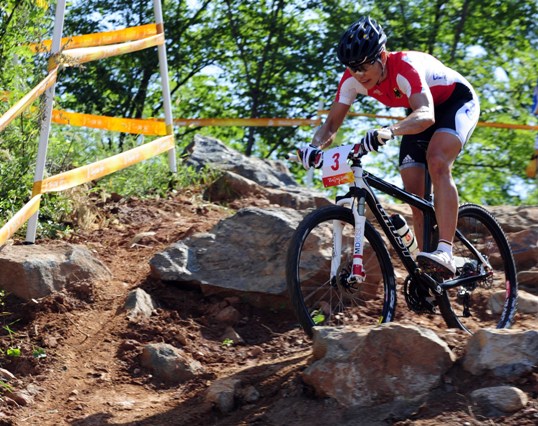 Sabine Spitz of Germany won the women's cross country mountain bike gold medal at the Beijing Olympic Games here on Saturday. Spitz clocked in 1:45.11 to win the title, Maja Wloszczowska of Poland got the silver by 0.41 seconds and Russian Irina Kalentyeva finished third by 1:17. [Xinhua]