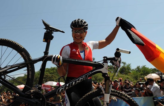 Sabine Spitz of Germany won the women's cross country mountain bike gold medal at the Beijing Olympic Games here on Saturday. Spitz clocked in 1:45.11 to win the title, Maja Wloszczowska of Poland got the silver by 0.41 seconds and Russian Irina Kalentyeva finished third by 1:17. [Xinhua]