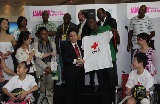 Bolt accetps the gift from CRCF. The world&apos;s fastest man makes a donation today through China Red Cross Fundation (CRCF) of 5 million USD to the earthquake affected area. At the event, Bolt wishes children in that region to retain their smile and he also invites 6 of them to his hometown Jamaica for a tour. [china.org.cn]
