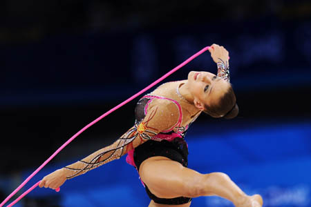 Evgeniya Kanaeva of Russia competes during the individual all-round final at the Beijing 2008 Olympic Games rhythmic gymnastics event in Beijing, China, Aug. 23, 2008. Evgeniya Kanaeva won the gold medal of the event. (Xinhua/Cheng Min)