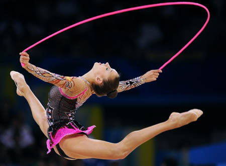 Evgeniya Kanaeva of Russia competes during the individual all-round final at the Beijing 2008 Olympic Games rhythmic gymnastics event in Beijing, China, Aug. 23, 2008. Evgeniya Kanaeva won the gold medal of the event. (Xinhua/Cheng Min)  