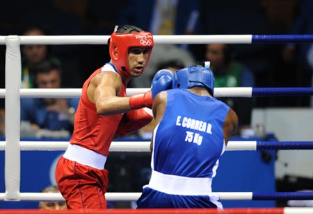 James Degale (red) of Great Britain competes against Emilio Correa Bayeaux of Cuba during Men's Middle (75kg) Final Bout of Beijing 2008 Olympic Games boxing event at Workers' Gymnasium in Beijing, China, Aug. 23, 2008. James Degale defeated Emilio Correa Bayeaux and won the gold medal of the event. 