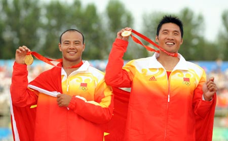 Gold medalists Meng Guanliang (R) and Yang Wenjun of China celebrate during the awarding ceremony of the men’s canoe double (C2) 500m final at Beijing 2008 Olympic Games in the Shunyi Rowing-Canoeing Park in Beijing, China, Aug. 23, 2008. 