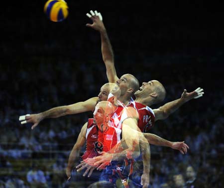 The multiple exposure photo shows that William Priddy of the United States serves the ball during men's volleyball gold medal match against Brazil at the Beijing Olympic Games in Beijing, China, Aug. 24, 2008. The United States beat Brazil and won the gold.