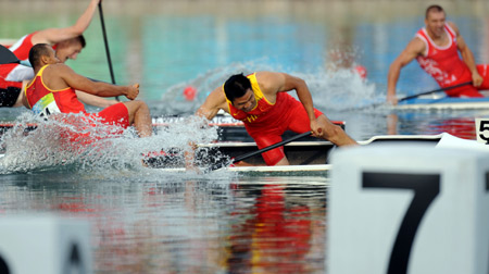 Meng Guanliang and Yang Wenjun of China plunge into water to celebrate in the men's canoe double (C2) 500m final at Beijing 2008 Olympic Games in the Shunyi Rowing-Canoeing Park in Beijing, China, Aug. 23, 2008. They won the gold medal. [Xinhua] 