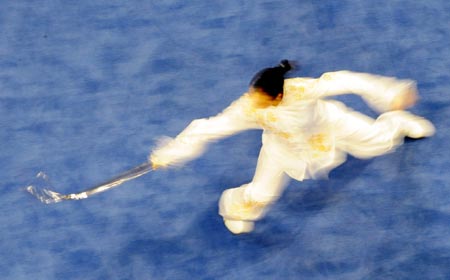 Ho Pak Kei Peggie of China's Hong Kong performs in the Taijijian section of women's Taijiquan and Taijijian combined competition of Beijing 2008 Wushu tournament, in Beijing, China, Aug. 23, 2008. She ranked 5th in the event. [Xinhua]