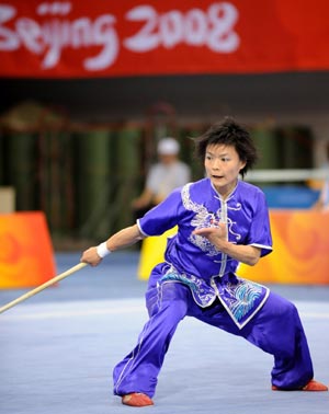 Geng Xiao Ling of China's Hong Kong performs in the women's Gunshu competition of Beijing 2008 Wushu tournament in Beijing, China, Aug. 23, 2008. She won the silver medal in the event with a score of 9.66 points. [Xinhua] 