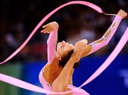  Evgeniya Kanaeva of Russia performs with ribbon during the individual all-round final at the Beijing 2008 Olympic Games rhythmic gymnastics event in Beijing, China, Aug. 23, 2008. Evgeniya Kanaeva won the gold medal of the event.[Xinhua]