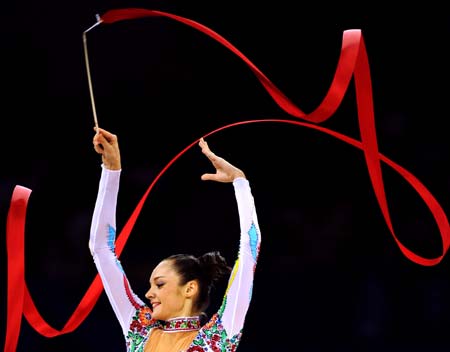 Anna Bessonova of Ukraine competes with the ribbon during the individual all-round final at the Beijing 2008 Olympic Games rhythmic gymnastics event in Beijing, China, Aug. 23, 2008. Anna Bessonova won the bronze medal of the event.[Xinhua]
