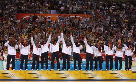 Players of the U.S. attend the awarding ceremony of Beijing 2008 Olympic Games men's basketball event at Olympic Basketball Gymnasium in Beijing, China, Aug. 24, 2008. The U.S. beat Spain 118-107 and won the gold medal of the event.