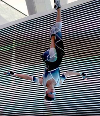 A man performs around the Olympic Green, north of Beijing on August 17, 2008. Performances brought by artists home and abroad have been staged in the Olympic Green during the Beijing Games. [Xinhua]