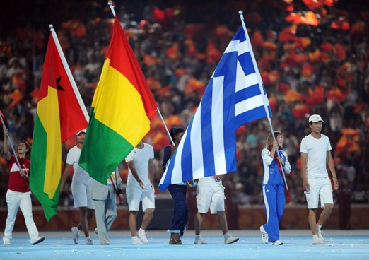 Greek flag enters the field. [Xinhua]