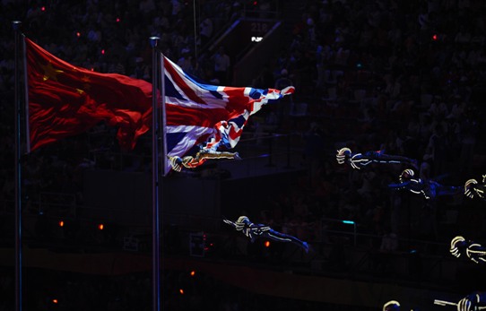 National flags of China and Great Britain line uo together at the stadium. London of UK will carry the banner and host the 2012 summer Olympics. [Xinhua]