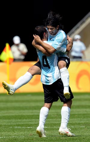 Players of Argentina celebrate after winning the men's gold match of football event between Nigeria and Argentina at Beijing 2008 Olympic Games in the National Stadium, known as the Bird's Nest, in Beijing, China, Aug. 23, 2008. Argentina beat Nigeria 1-0 and claimed the title in this event. 