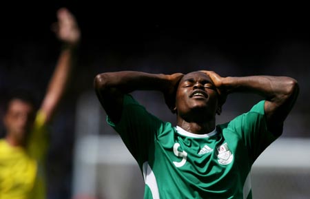 A Nigerian player leaves the field after the men's gold match of football event between Nigeria and Argentina at Beijing 2008 Olympic Games in the National Stadium, known as the Bird's Nest, in Beijing, China, Aug. 23, 2008. Argentina beat Nigeria 1-0 and claimed the title in this event.