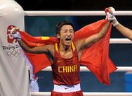 Zou Shiming revels in his victory in the light flyweight boxing final on Sunday. [XInhua] 