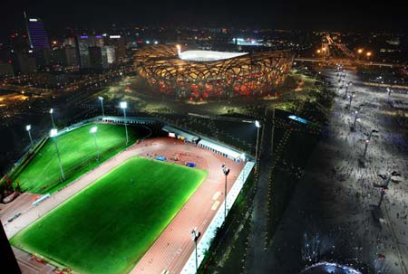 Photo taken on Aug. 22, 2008 shows the nightscape of the Olympic Green, in Beijing, capital of China. The Olympic Green enjoys a beautiful night view shining with colors and lights during the Beijing 2008 Olympic Games.