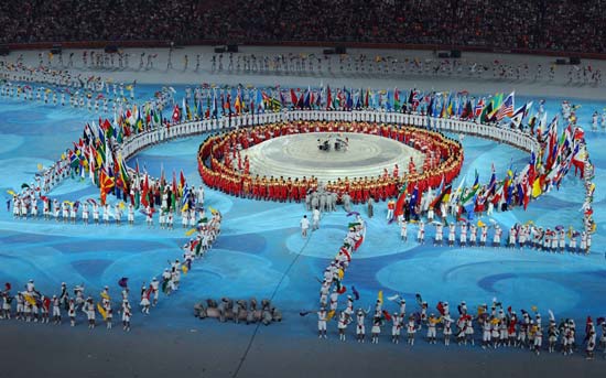 World athletes that competed at the Beijing 2008 Olympic Games and the flags of the 204 participating delegations are ushered into the National Stadium, or the Bird's Nest, at the Beijing 2008 Olympic Games closing ceremony in Beijing, capital of China, on Aug. 24, 2008. (Xinhua/Guo Dayue