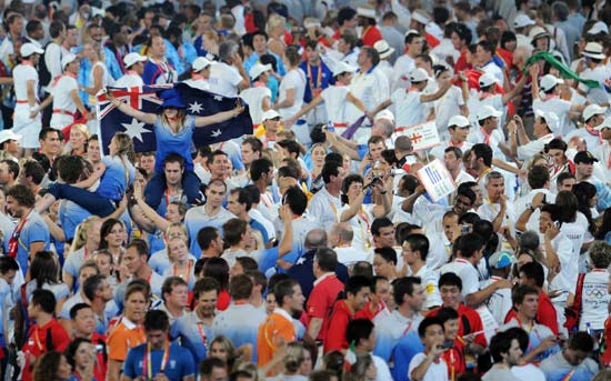 World athletes that competed at the Beijing 2008 Olympic Games and the flags of the 204 participating delegations are ushered into the National Stadium, or the Bird's Nest, at the Beijing 2008 Olympic Games closing ceremony in Beijing, capital of China, on Aug. 24, 2008. (Xinhua/Yang Lei)