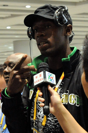 Jamaica's Olympic gold medalist Usain Bolt is interviewed at the Beijing Capital International Airport in Beijing, capital of China, Aug. 25, 2008. The airport saw a peak traffic volume on Monday as many Olympic delegations left the Chinese capital. A total of 32,596 passengers would leave Beijing throughout the day, doubling the usual figure. (Xinhua/Tang Zhaoming) 