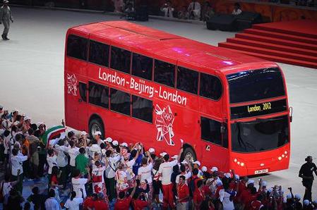 A double decker bus arrives during the closing ceremony for the 2008 Beijing Olympic Games at the National Stadium also know as the 'Bird's Nest' on August 24, 2008. [Xinhua] 