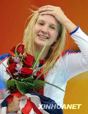 Rebecca Adlington reacts on the podium during the awarding ceremony of women's 400m freestyle at the Beijing 2008 Olympic Games in the National Aquatics Center, also known as the Water Cube in Beijing, China, Aug. 11, 2008. Rebecca Adlington won the gold with 4 minutes 3.22 seconds.