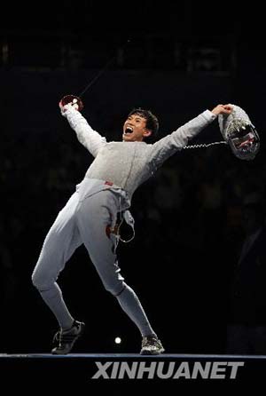Zhong Man of China celebrates during the men's individual sabre gold medal match of fencing against Nicolas Lopez of France at Beijing 2008 Olympic Games in Beijing, China, Aug. 12, 2008. Zhong Man of China won the gold medal in the event.