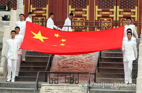 Photo: The Chinese national flag is carried during the ceremony