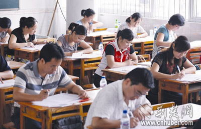 Teachers in Donghu district in Wuhan, central China's Hubei Province are taking an exam on Tuesday, August 26, 2008. 
