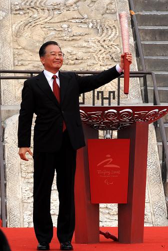 Premier Wen Jiabao lights the Beijing Paralympic flame.