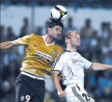 Juventus' Vincenzo Iaquinta (left) vies for the ball with Artmedia Bratislava's Peter Burak during their UEFA Champions League qualifying soccer match on Tuesday in Bratislava. 