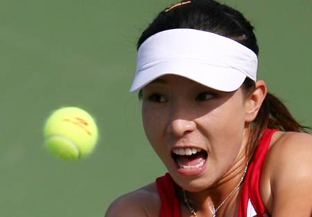 China's Zheng Jie acts against Spain's Anabel Medina Garrigues during the second round competition of women's singles at US Open tennis in New York, Aug. 27, 2008. Zheng Jie won the match 6-1, 6-4.