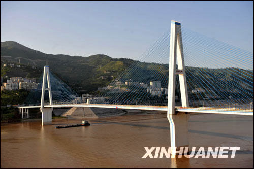 A ship passing under the Kuimen Bridge on the Yangtze River, August 22, 2008.   