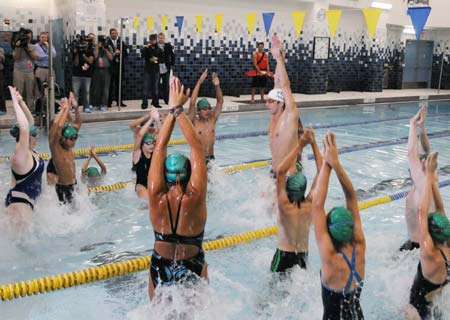 Olympic gold medallist Michael Phelps teaches swimming exercise techniques to children at the YMCA of Greater New York in New York August 28, 2008.