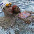 Phelps teaches kids swimming techniques
