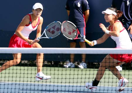 Zheng Jie (R) and Yan Zi of China compete during their first round match against Agnieszka Radwanska and Urszula Radwanska of Poland at the US Open tennis tournament Aug. 28, 2008 in Flushing Meadows, NY. They won 2-1. 