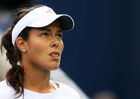 Ana Ivanovic, of Serbia reacts during her match with Julie Coin of France at the U.S. Open tennis tournament at Flushing Meadows in New York, Aug. 28, 2008. 