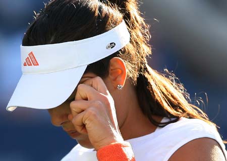 Ana Ivanovic of Serbia reacts during her match with Julie Coin of France at the U.S. Open tennis tournament at Flushing Meadows in New York, Aug. 28, 2008. 