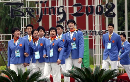 Athletes of Chinese delegation walk through the Paralympic village in Beijing, China, Aug. 30, 2008. The Paralympic village officially opened to athletes from all over the world on Saturday for the Beijing Paralympic Games.