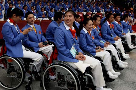 Athletes of the Chinese delegation attend the opening ceremony of the Paralympic village in Beijing, China, Aug. 30, 2008. The Paralympic village officially opened to athletes from all over the world on Saturday for the Beijing Paralympic Games. 