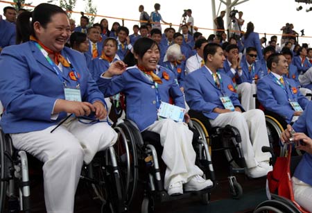 Athletes of the Chinese delegation attend the opening ceremony of the Paralympic village in Beijing, China, Aug. 30, 2008. The Paralympic village officially opened to athletes from all over the world on Saturday for the Beijing Paralympic Games. [Xinhua]